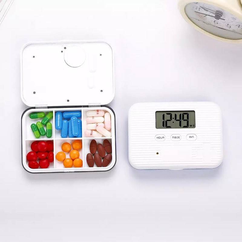 tablet dispenser with alarm